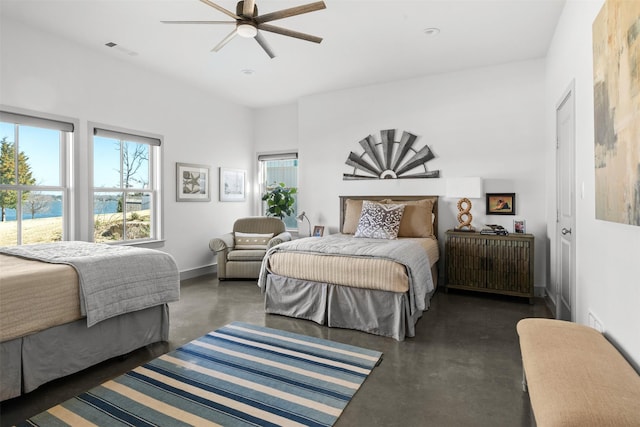 13390 Waterside Dr, Malakoff, TX 75148 - bedroom with finished concrete flooring, multiple windows, baseboards, and ceiling fan