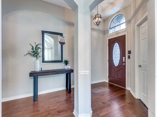 6356 Redeagle Creek Dr, Fort Worth, TX 76179 - foyer with hardwood / wood-style floors, a chandelier, arched walkways, and baseboards
