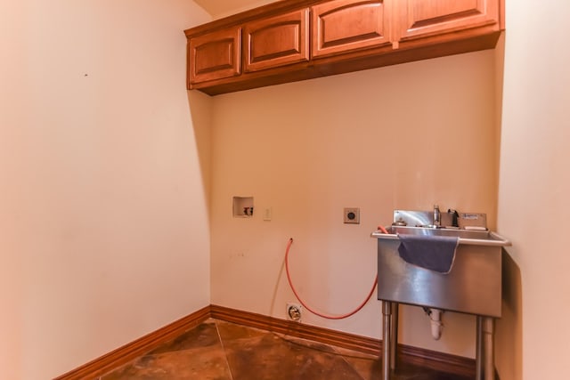 701 N Sulphur St, Dodd City, TX 75438 - laundry room with cabinet space, electric dryer hookup, hookup for a washing machine, tile patterned floors, and baseboards