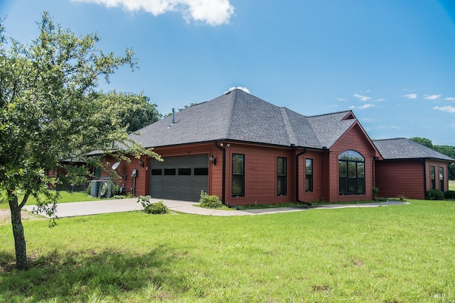 701 N Sulphur St, Dodd City, TX 75438 - view of front of house featuring an attached garage, a front lawn, roof with shingles, cooling unit, and driveway
