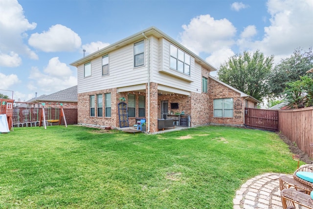 2745 Sunlight Dr, Little Elm, TX 75068 - back of house with a playground, a patio area, and brick siding