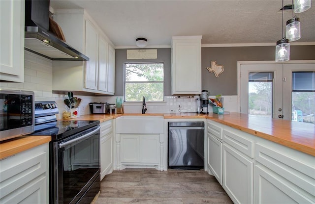 23899 Sagewood Ln, Bedias, TX 77831 - kitchen with dishwashing machine, wall chimney exhaust hood, electric stove, butcher block countertops, and a sink
