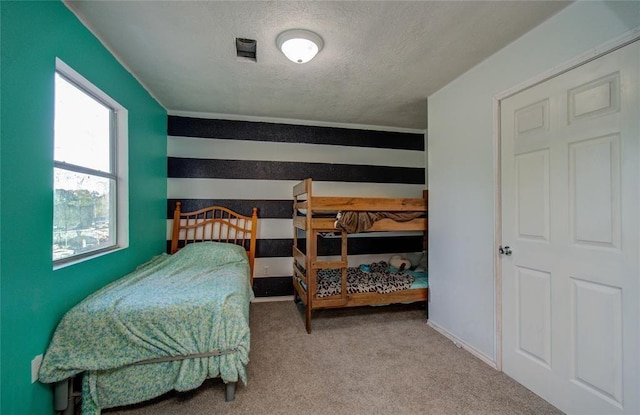 23899 Sagewood Ln, Bedias, TX 77831 - bedroom featuring a textured ceiling and carpet floors