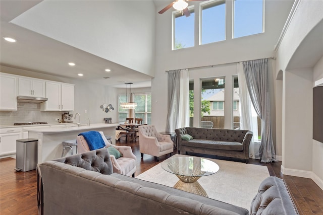 11408 Morrow Ln, Mckinney, TX 75071 - living area featuring healthy amount of natural light, dark wood finished floors, a ceiling fan, recessed lighting, and a towering ceiling