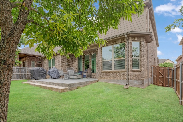 11408 Morrow Ln, Mckinney, TX 75071 - rear view of house featuring brick siding, a patio area, and a fenced backyard