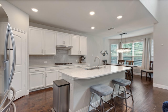 11408 Morrow Ln, Mckinney, TX 75071 - kitchen featuring gas stovetop, stainless steel fridge, dark wood-style floors, white cabinetry, and recessed lighting