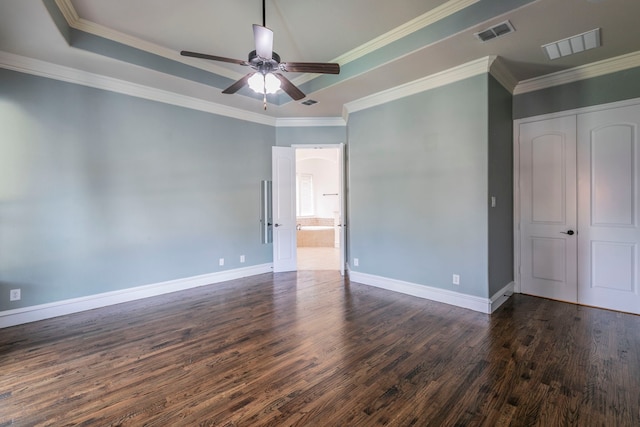 7132 Jernigan Dr, Frisco, TX 75034 - unfurnished room featuring dark wood finished floors, ceiling fan, a raised ceiling, and crown molding