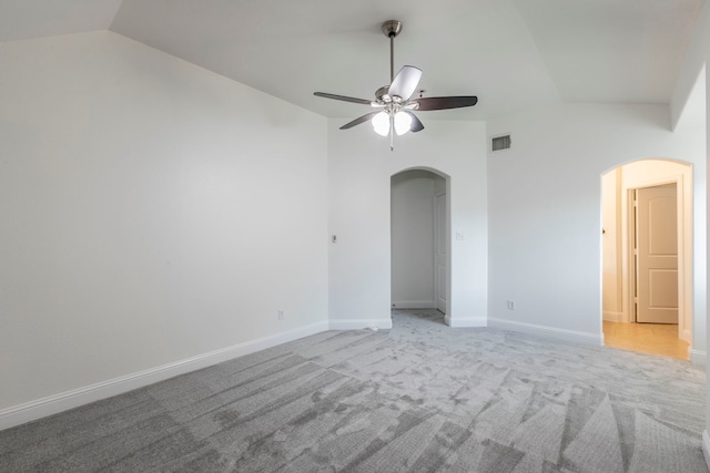 7132 Jernigan Dr, Frisco, TX 75034 - spare room featuring arched walkways, vaulted ceiling, a ceiling fan, and light carpet