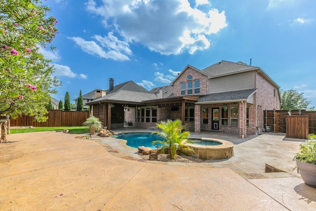 7132 Jernigan Dr, Frisco, TX 75034 - rear view of property featuring a patio, brick siding, a fenced backyard, and roof with shingles
