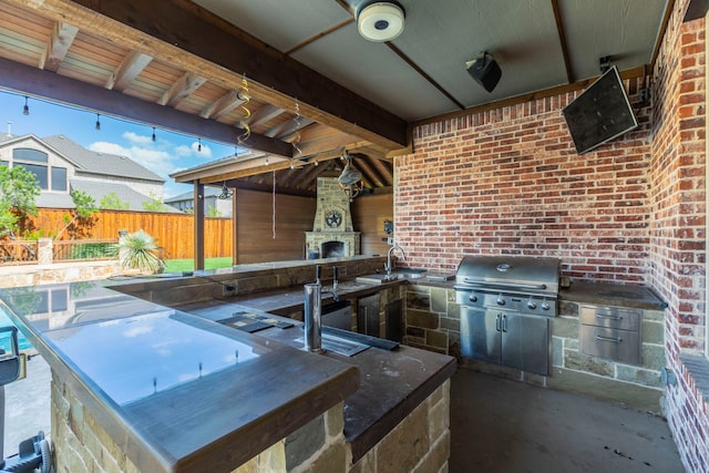 7132 Jernigan Dr, Frisco, TX 75034 - view of patio / terrace featuring exterior kitchen and exterior fireplace