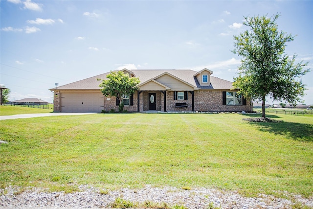 131 Live Oak Ln, Decatur, TX 76234 - view of front of house with driveway, brick siding, an attached garage, and covered porch