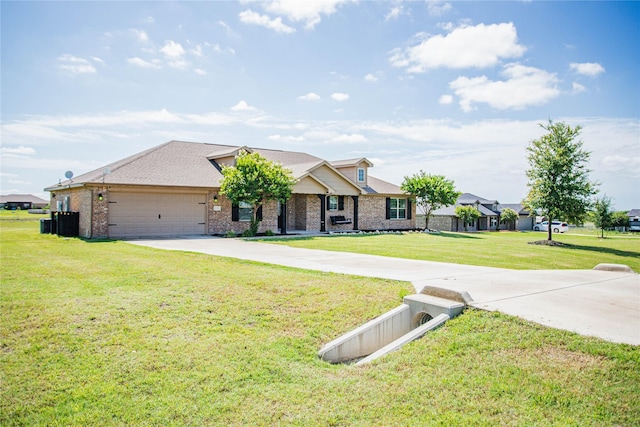 131 Live Oak Ln, Decatur, TX 76234 - view of front of home with an attached garage, a front lawn, concrete driveway, and brick siding