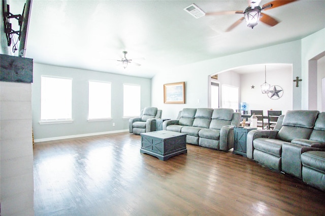 131 Live Oak Ln, Decatur, TX 76234 - living area with a ceiling fan, dark wood-style floors, arched walkways, a chandelier, and healthy amount of natural light
