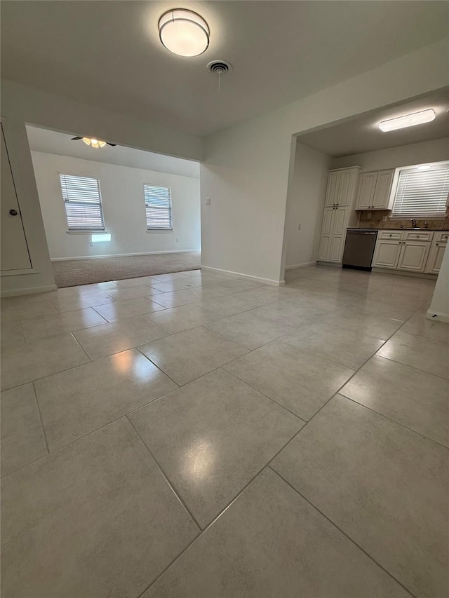 1833 Hood St, Carrollton, TX 75006 - unfurnished living room featuring light tile patterned floors and baseboards