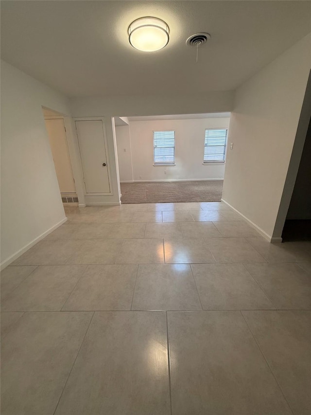 1833 Hood St, Carrollton, TX 75006 - unfurnished room with baseboards and light tile patterned floors