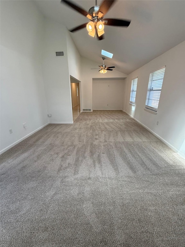 1833 Hood St, Carrollton, TX 75006 - spare room with ceiling fan, lofted ceiling, a skylight, carpet, and baseboards