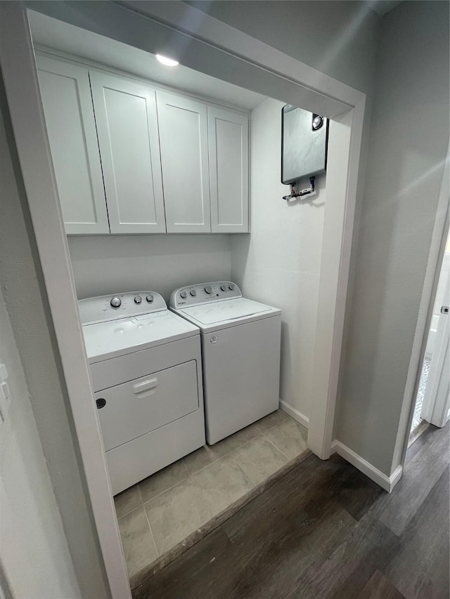 1833 Hood St, Carrollton, TX 75006 - laundry room with wood finished floors, separate washer and dryer, cabinet space, and baseboards