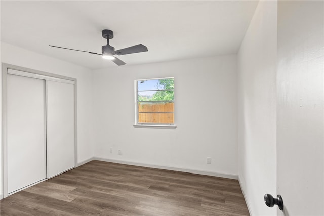 3812 David Ln, Forest Hill, TX 76119 - unfurnished bedroom with wood finished floors, a closet, baseboards, and a ceiling fan