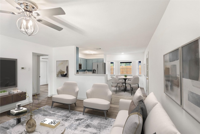 3812 David Ln, Forest Hill, TX 76119 - living area with ceiling fan, light wood-type flooring, and baseboards