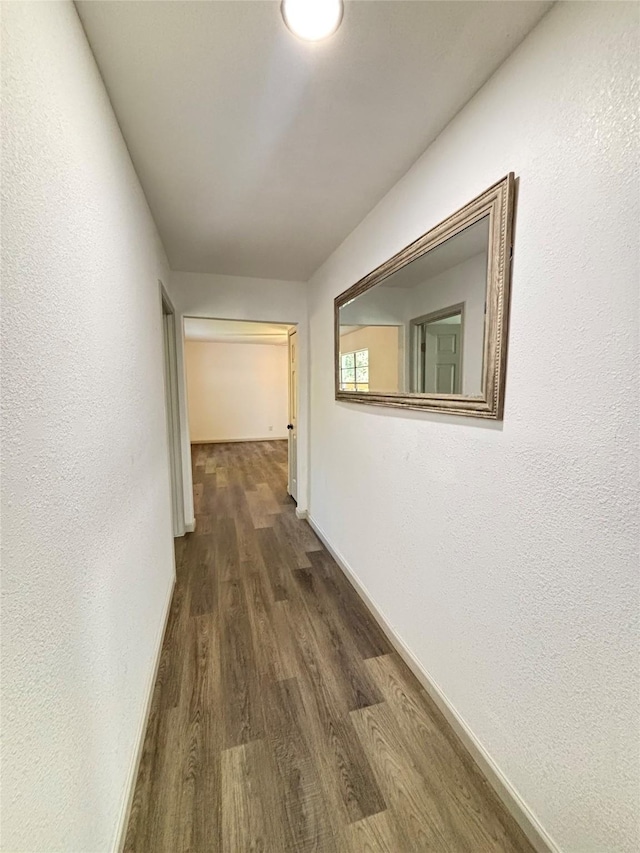 3812 David Ln, Forest Hill, TX 76119 - hall featuring dark wood-style flooring, baseboards, and a textured wall