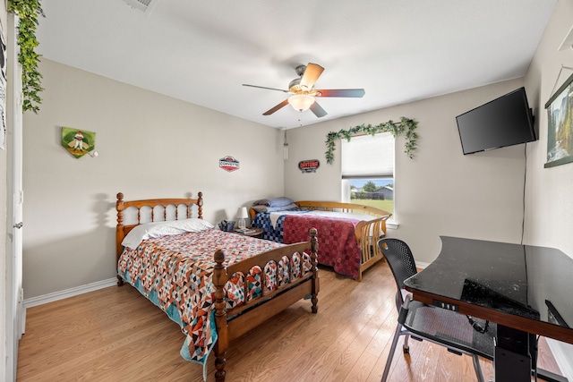 1329 E Highland Rd, Waxahachie, TX 75167 - bedroom featuring light wood-type flooring, ceiling fan, and baseboards