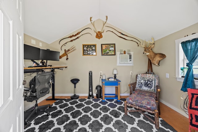 1329 E Highland Rd, Waxahachie, TX 75167 - living area with lofted ceiling, wood finished floors, and baseboards