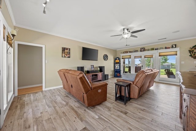1329 E Highland Rd, Waxahachie, TX 75167 - living area with ceiling fan, light wood finished floors, crown molding, and baseboards