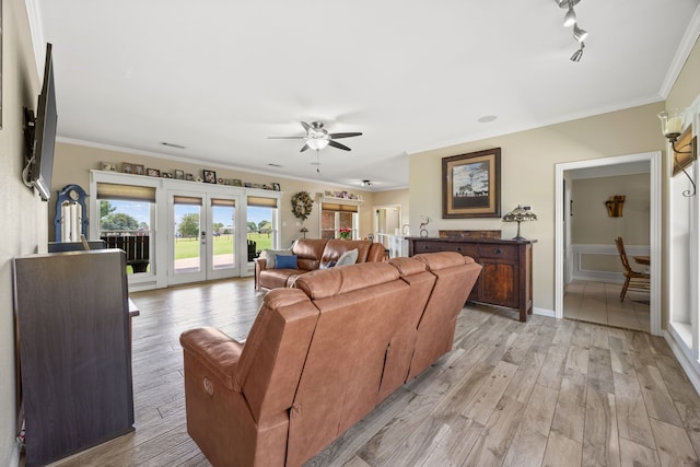 1329 E Highland Rd, Waxahachie, TX 75167 - living room with french doors, ceiling fan, crown molding, light wood-style floors, and baseboards