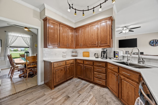 1329 E Highland Rd, Waxahachie, TX 75167 - kitchen featuring ceiling fan, a sink, dishwasher, brown cabinetry, and ornamental molding