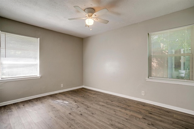 1909 Balla Way, Grand Prairie, TX 75051 - unfurnished room featuring wood finished floors, ceiling fan, baseboards, and a textured ceiling