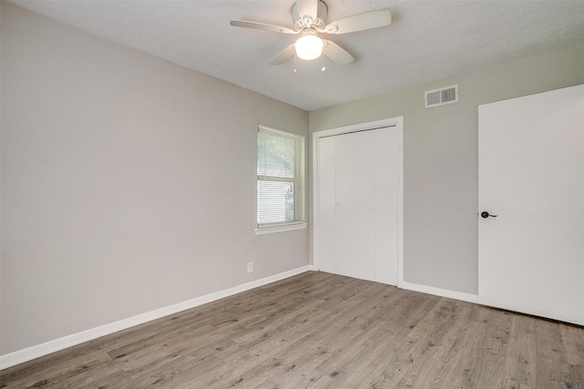 1909 Balla Way, Grand Prairie, TX 75051 - unfurnished bedroom featuring wood finished floors, a closet, baseboards, and ceiling fan