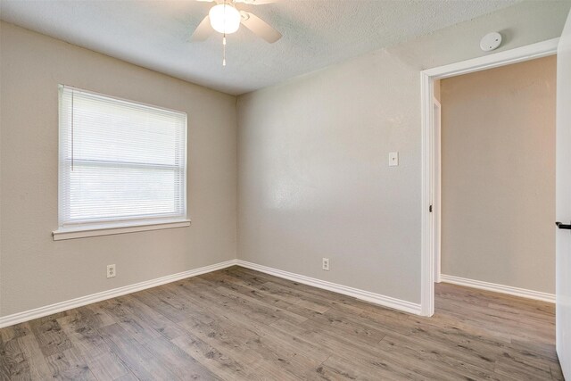1909 Balla Way, Grand Prairie, TX 75051 - unfurnished room featuring wood finished floors, baseboards, and a ceiling fan