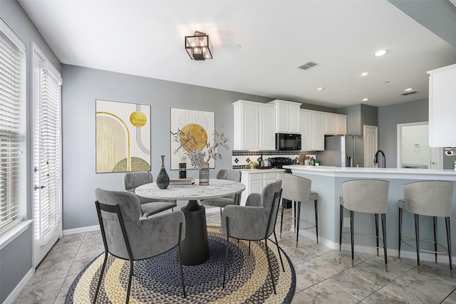 1635 Southwestern Dr, Allen, TX 75013 - dining area with baseboards and recessed lighting