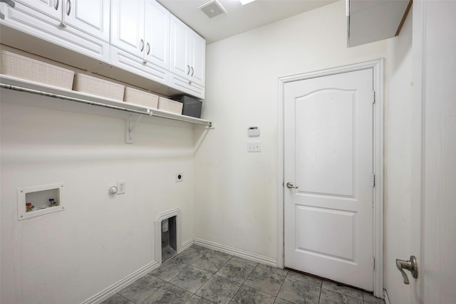 1635 Southwestern Dr, Allen, TX 75013 - laundry area with cabinet space, electric dryer hookup, baseboards, washer hookup, and gas dryer hookup
