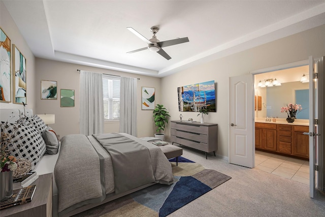 1635 Southwestern Dr, Allen, TX 75013 - bedroom with light colored carpet, a tray ceiling, ensuite bathroom, baseboards, and a ceiling fan