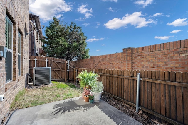1635 Southwestern Dr, Allen, TX 75013 - fenced backyard with cooling unit, a patio, and a gate