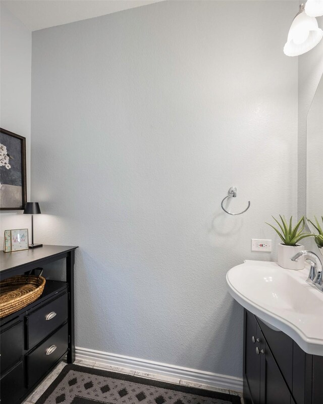 1635 Southwestern Dr, Allen, TX 75013 - bathroom featuring vanity and baseboards