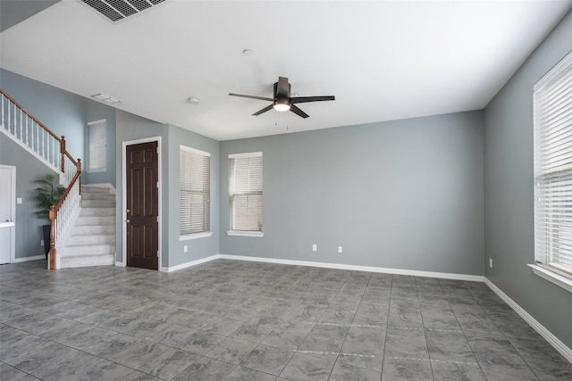 1635 Southwestern Dr, Allen, TX 75013 - tiled empty room featuring a ceiling fan, stairs, and baseboards