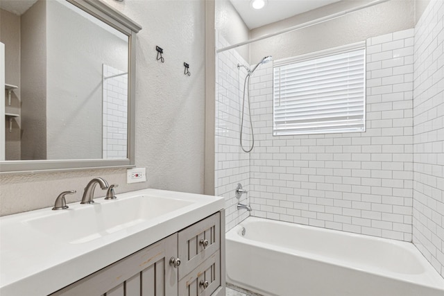 318 S Montreal Ave, Dallas, TX 75208 - full bath featuring a textured wall, shower / bathtub combination, and vanity