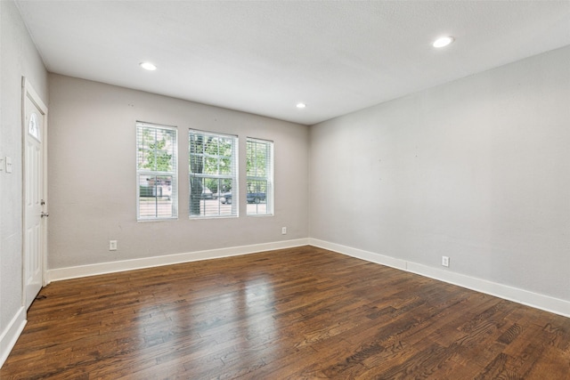 318 S Montreal Ave, Dallas, TX 75208 - unfurnished room featuring dark wood-style flooring, baseboards, and recessed lighting