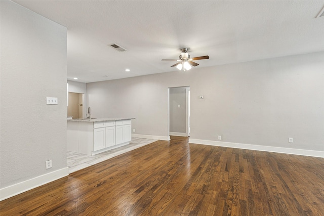 318 S Montreal Ave, Dallas, TX 75208 - empty room featuring ceiling fan, wood finished floors, baseboards, recessed lighting, and a sink