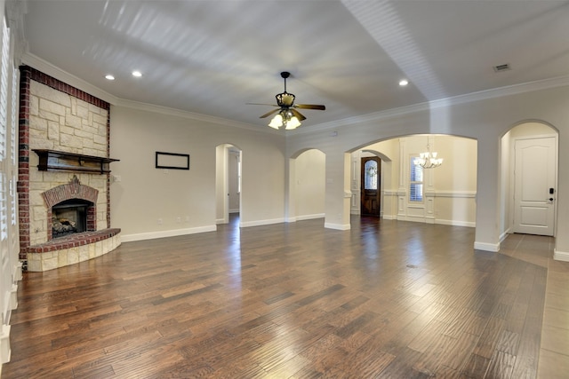 6520 Stone Creek Dr, North Richland Hills, TX 76182 - unfurnished living room with a ceiling fan, a large fireplace, crown molding, wood finished floors, and recessed lighting