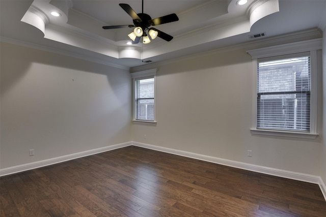 6520 Stone Creek Dr, North Richland Hills, TX 76182 - spare room featuring crown molding, a ceiling fan, dark wood-style floors, a raised ceiling, and baseboards