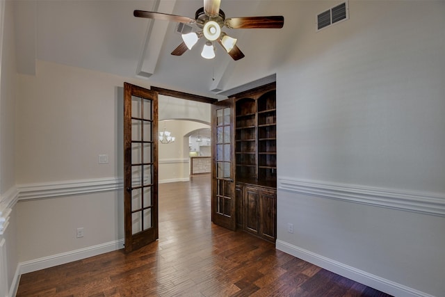 6520 Stone Creek Dr, North Richland Hills, TX 76182 - empty room featuring arched walkways, dark wood finished floors, lofted ceiling, ceiling fan, and baseboards