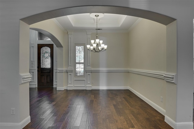 6520 Stone Creek Dr, North Richland Hills, TX 76182 - unfurnished dining area with arched walkways, a chandelier, wood finished floors, a tray ceiling, and crown molding