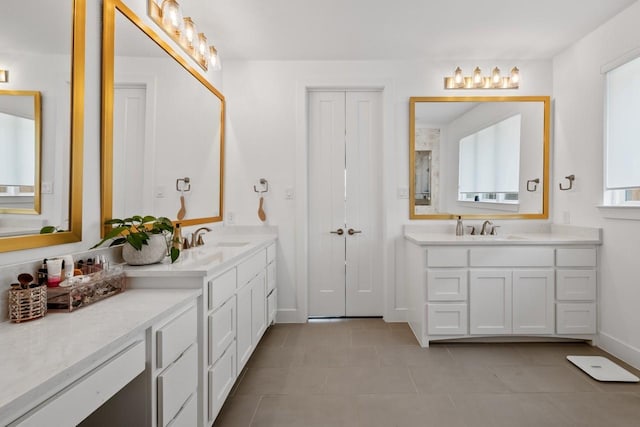 2104 Zaide Way, Celina, TX 75009 - bathroom with two vanities, tile patterned flooring, and baseboards