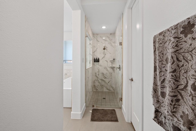 2104 Zaide Way, Celina, TX 75009 - bathroom featuring tile patterned flooring, a marble finish shower, a tub to relax in, and baseboards