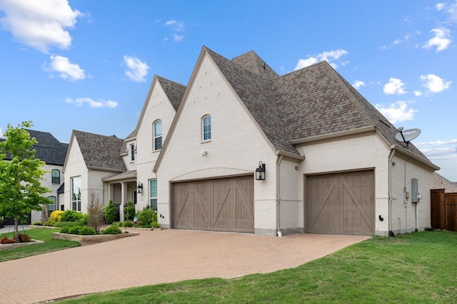 2104 Zaide Way, Celina, TX 75009 - french provincial home featuring roof with shingles, brick siding, and decorative driveway