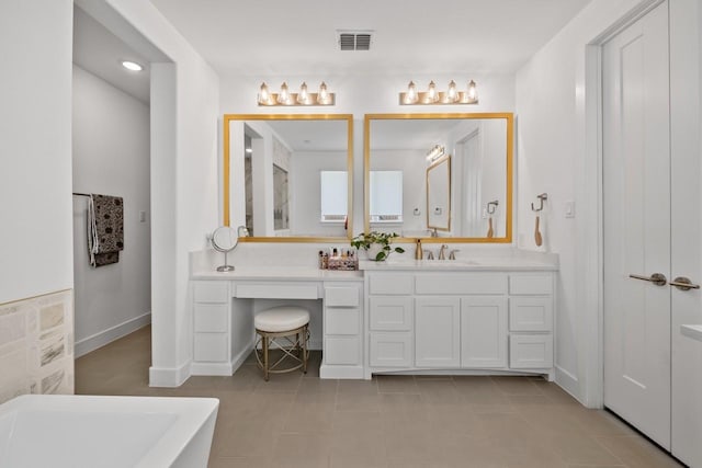 2104 Zaide Way, Celina, TX 75009 - bathroom featuring a soaking tub, vanity, tile patterned flooring, baseboards, and recessed lighting