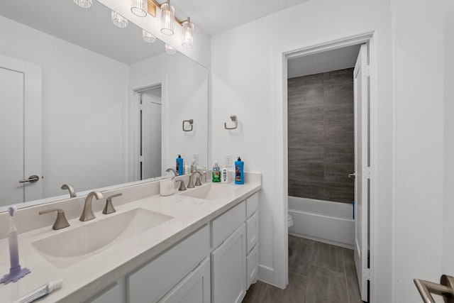 2104 Zaide Way, Celina, TX 75009 - full bathroom featuring double vanity, toilet, wood finished floors, and shower / bath combination